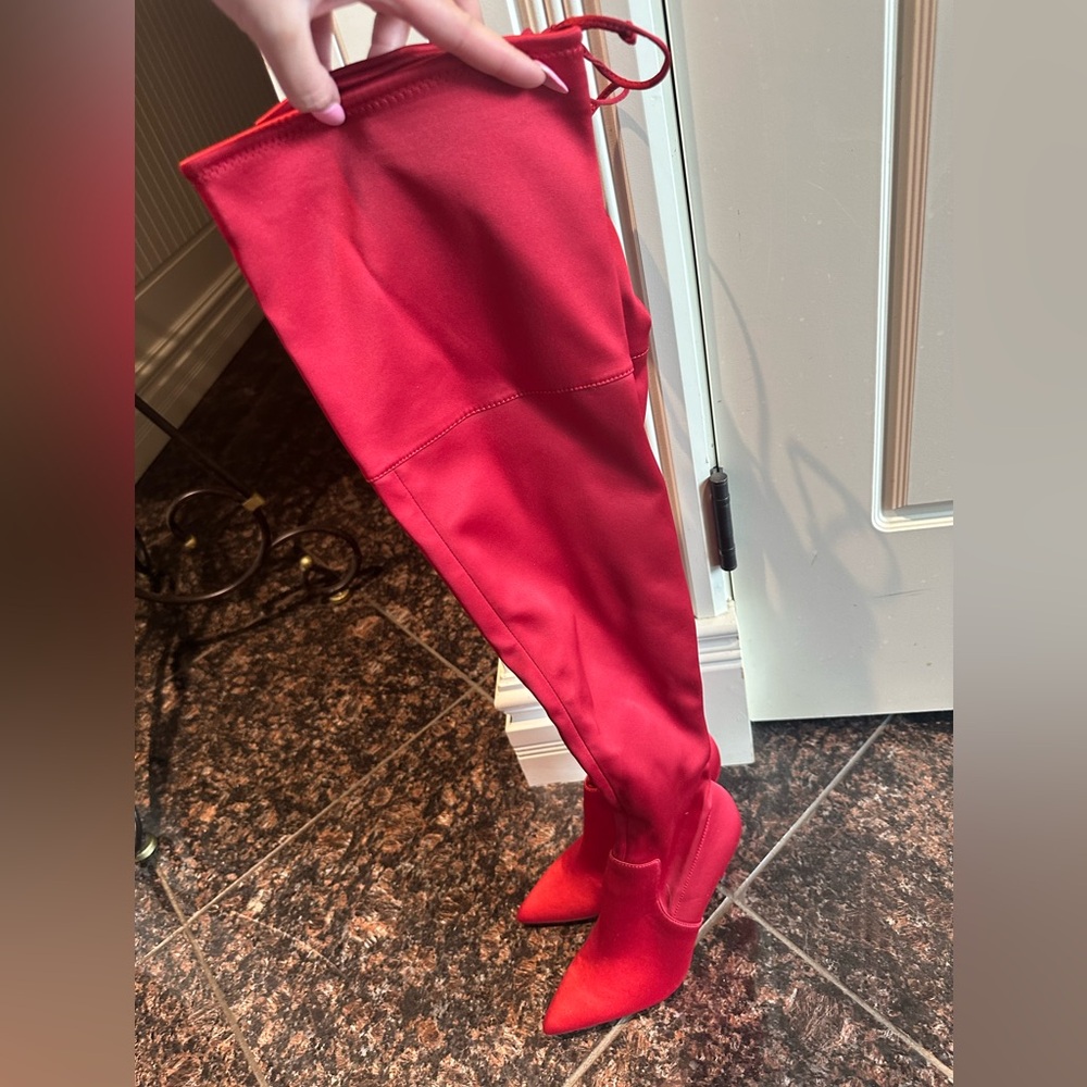 Thigh high heeled boots